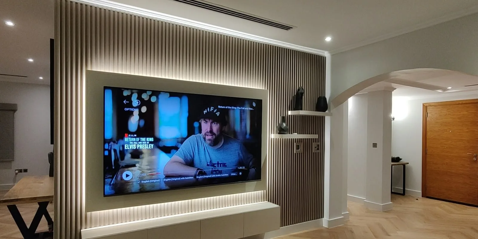 Fluted TV wall with LED backlight and floating console
